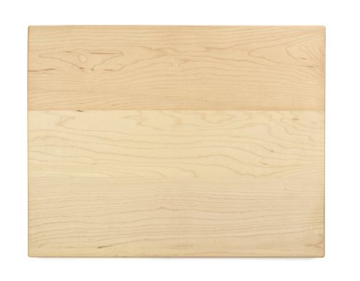 Plain maple wooden cutting board on a white background