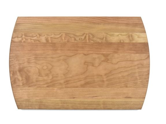 Back side of cherry hardwood cutting board with a natural grain pattern on a white background