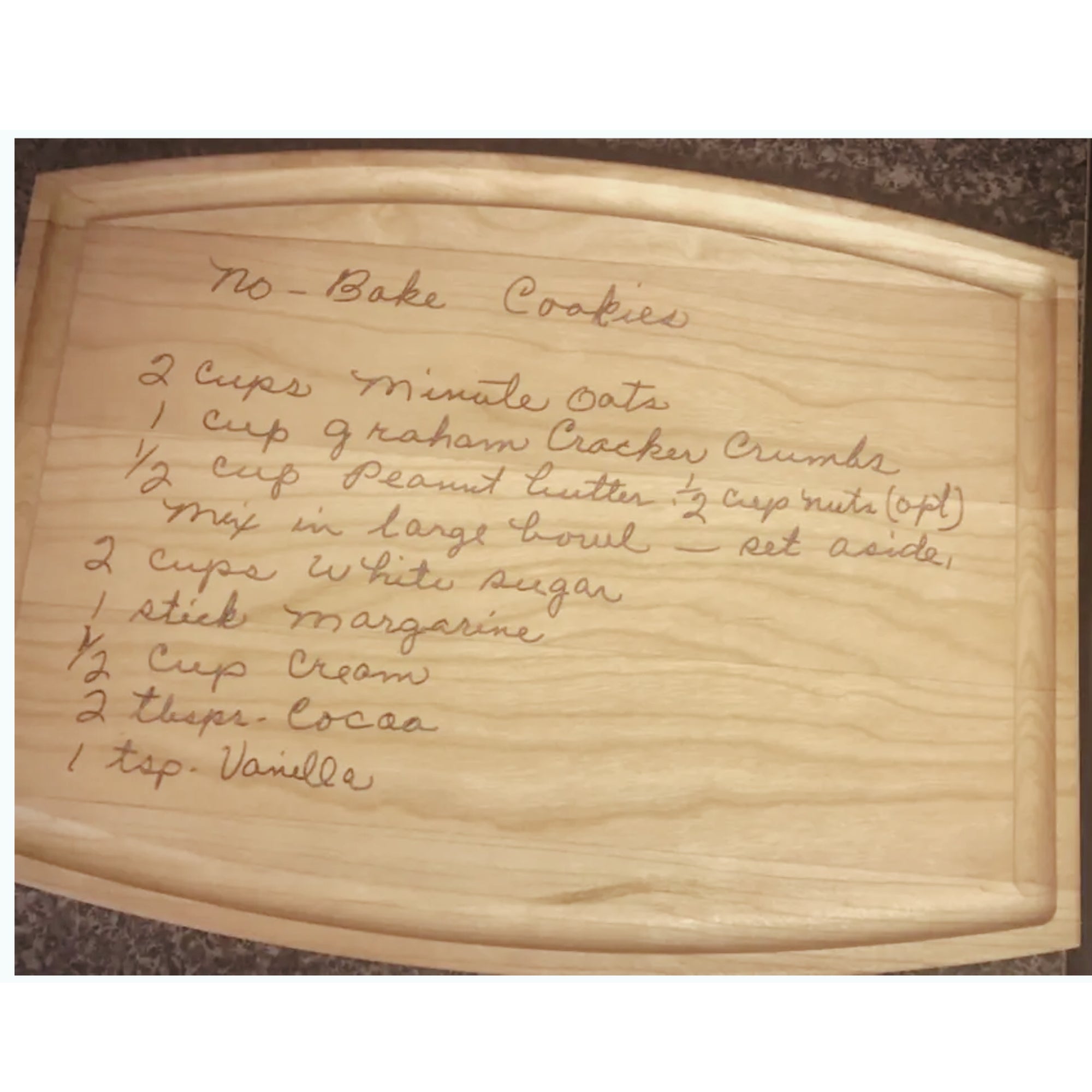 Wooden cutting board with handwritten cookie recipe