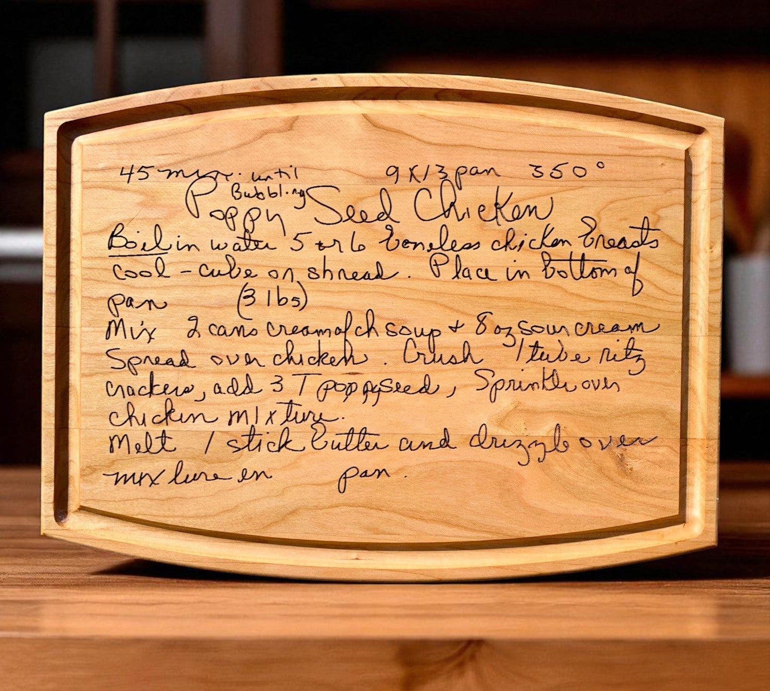Wooden cutting board with handwritten recipe
