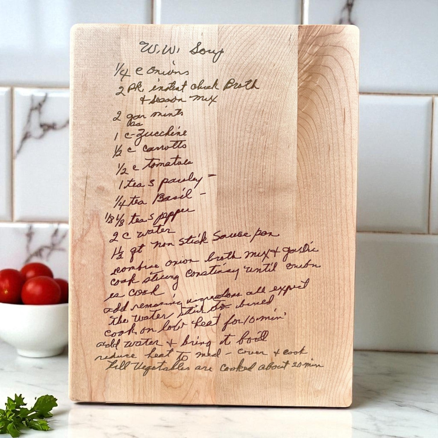 Wooden cutting board with engraved recipe on a kitchen counter